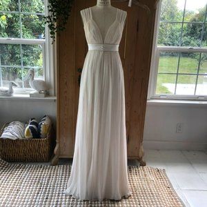 Elegant Silk Ivory Wedding Gown with wide skirts,